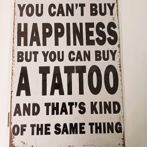 metalen bord you can't buy happiness but you can buy a tattooo